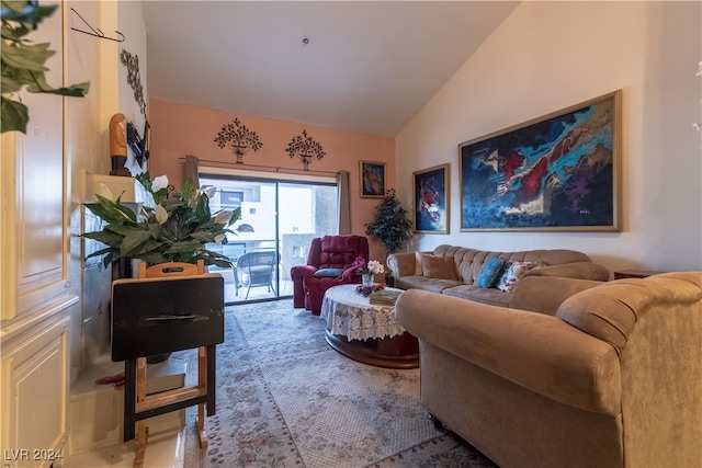 living room featuring lofted ceiling