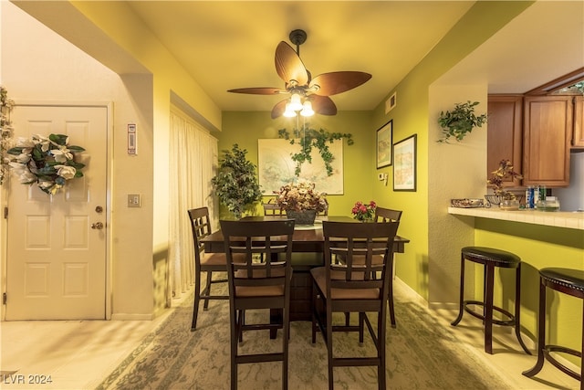 dining space featuring ceiling fan