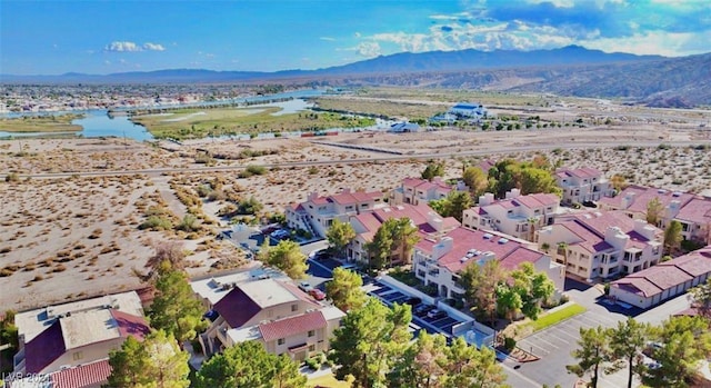 bird's eye view with a water and mountain view