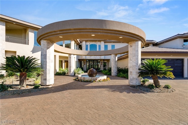 exterior space with a balcony and a garage