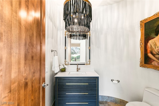 bathroom with toilet and vanity