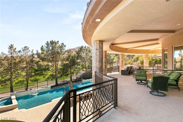 exterior space featuring a fenced in pool, a mountain view, and pool water feature