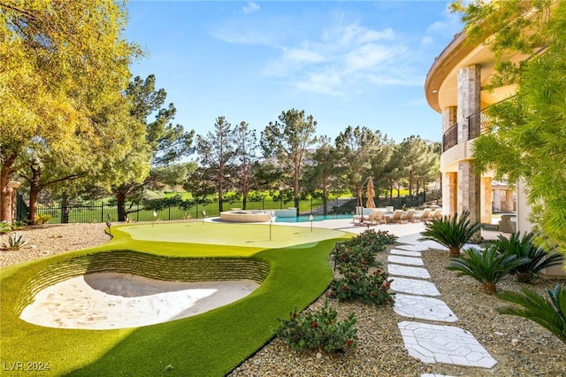 view of property's community with a pool and a patio area