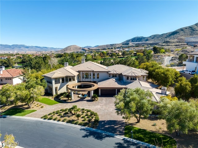 birds eye view of property with a mountain view