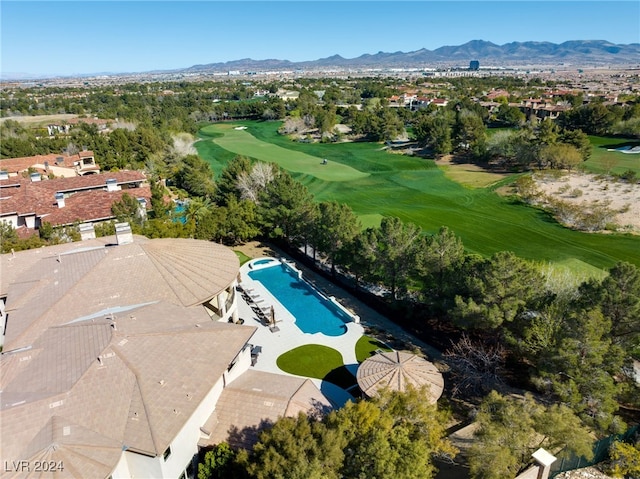 birds eye view of property with a mountain view