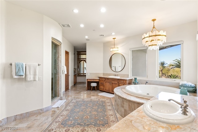 bathroom featuring vanity, an inviting chandelier, and plus walk in shower