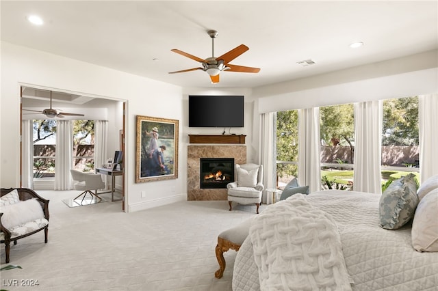 bedroom featuring light colored carpet and ceiling fan