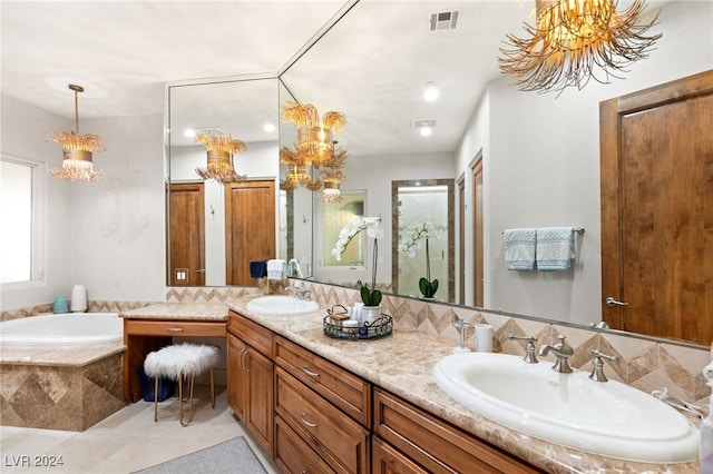 bathroom with a relaxing tiled tub, tile patterned floors, vanity, decorative backsplash, and an inviting chandelier