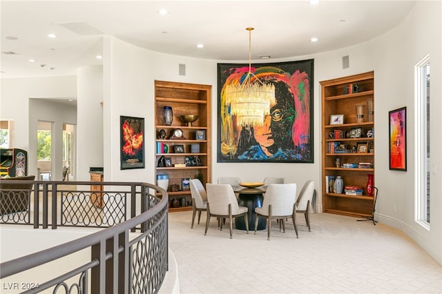 dining space with an inviting chandelier