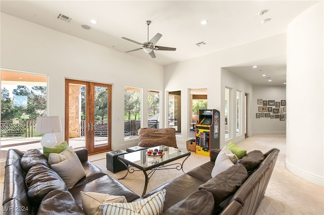 living room with french doors and ceiling fan