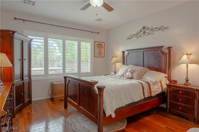 bedroom featuring ceiling fan and hardwood / wood-style flooring