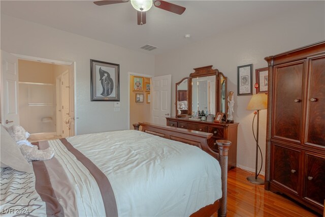 bedroom with light hardwood / wood-style flooring and ceiling fan