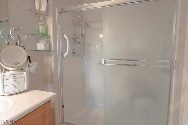 bathroom with vanity and walk in shower