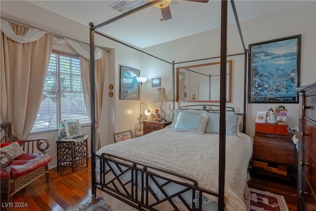 bedroom with ceiling fan and hardwood / wood-style floors