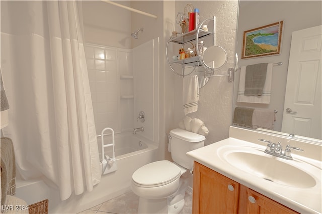 full bathroom featuring toilet, shower / bath combo, vanity, and tile patterned floors