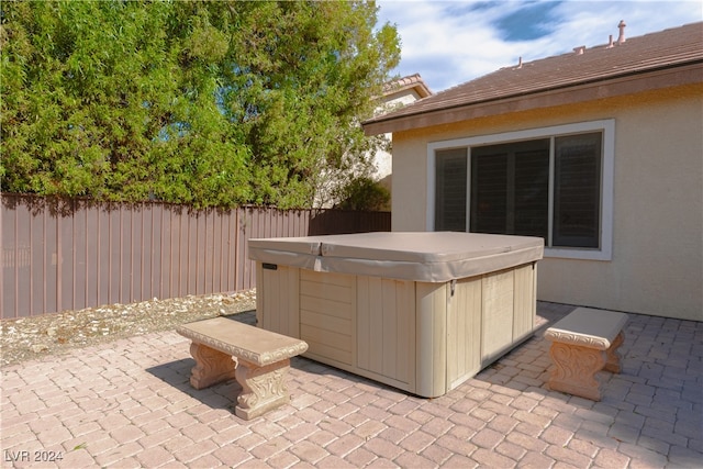 view of patio with a hot tub