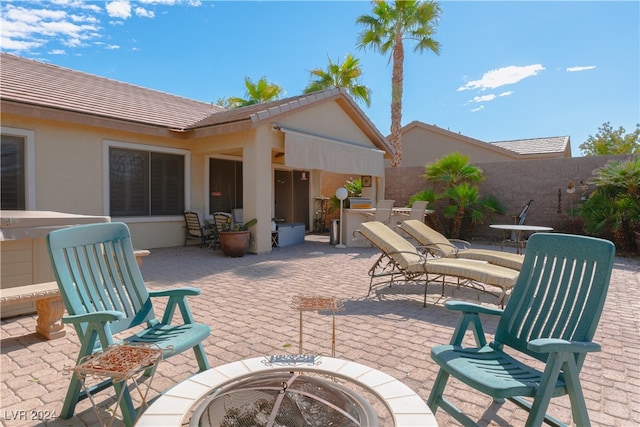 view of patio / terrace with a fire pit