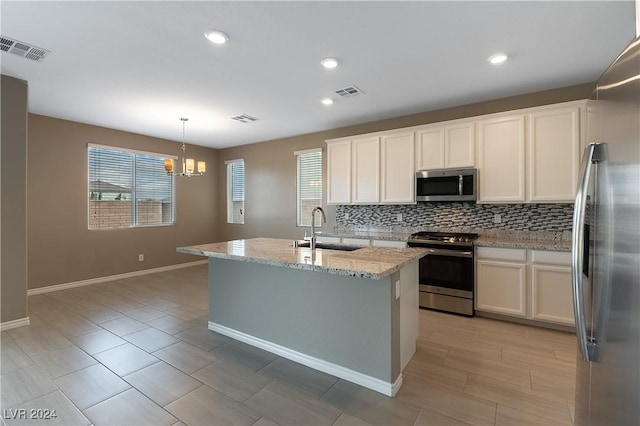 kitchen featuring white cabinetry, visible vents, appliances with stainless steel finishes, and a sink