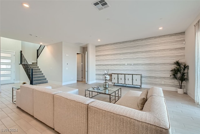 living room featuring tile walls