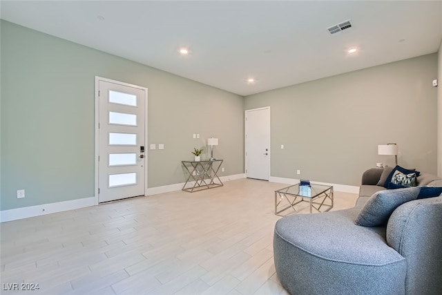 living room with light hardwood / wood-style floors