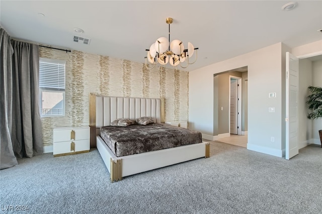 carpeted bedroom featuring an inviting chandelier