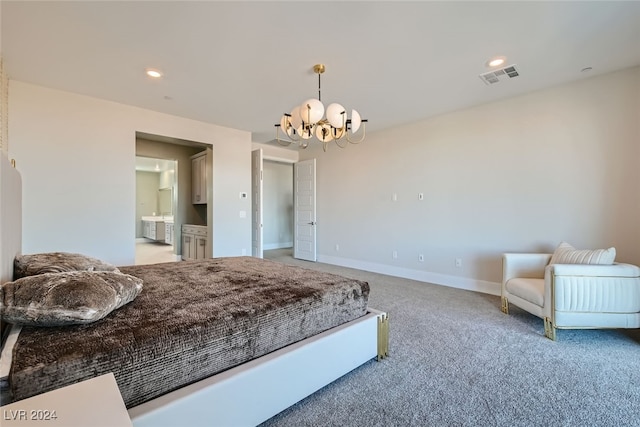 bedroom with an inviting chandelier, ensuite bath, and light colored carpet