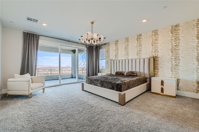 carpeted bedroom featuring a chandelier and access to exterior