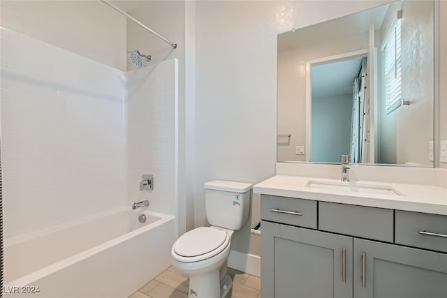 full bathroom featuring toilet, shower / washtub combination, vanity, and tile patterned floors