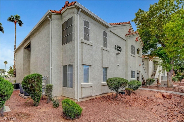 view of home's exterior with central AC unit