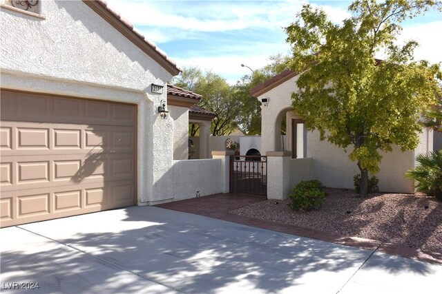 view of side of property with a garage