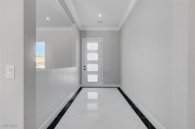 entryway featuring crown molding and light tile patterned floors