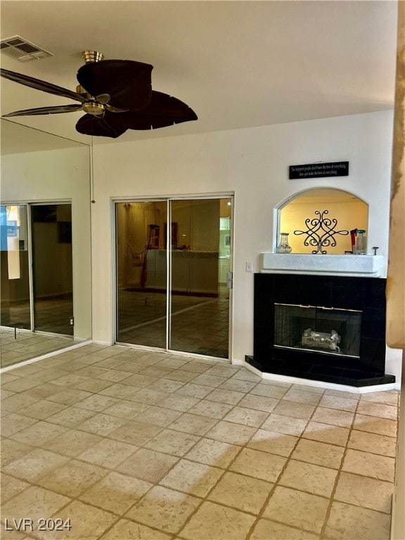 interior space featuring ceiling fan