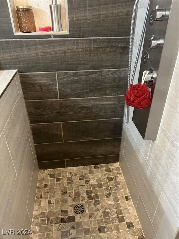 bathroom featuring a shower