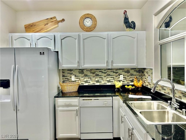 kitchen featuring a sink, white cabinetry, and white appliances
