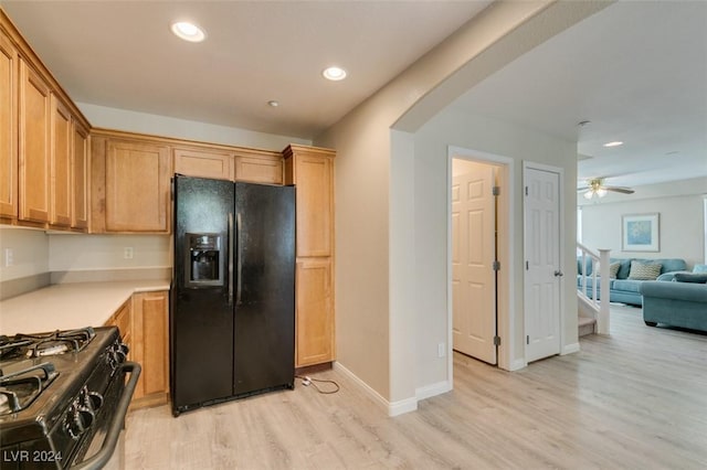 kitchen featuring light hardwood / wood-style flooring, black appliances, and ceiling fan