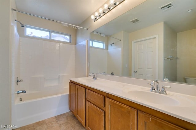 full bathroom featuring vanity, shower / bathing tub combination, and toilet