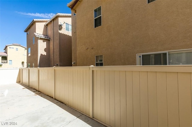 view of side of property with a patio area