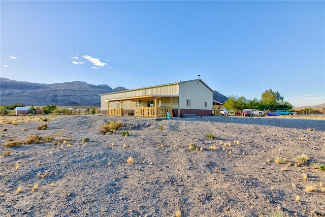 rear view of property with a mountain view