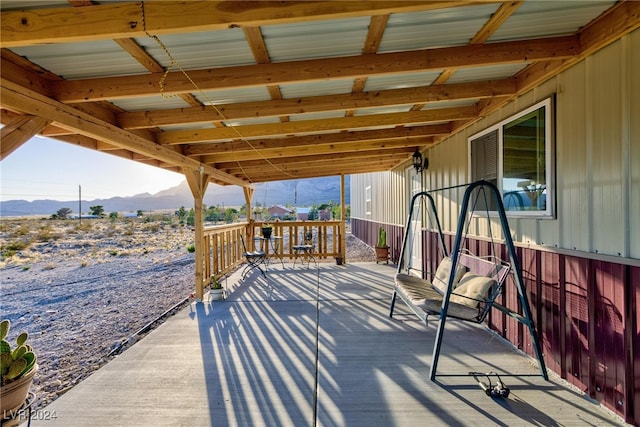 wooden terrace with a mountain view