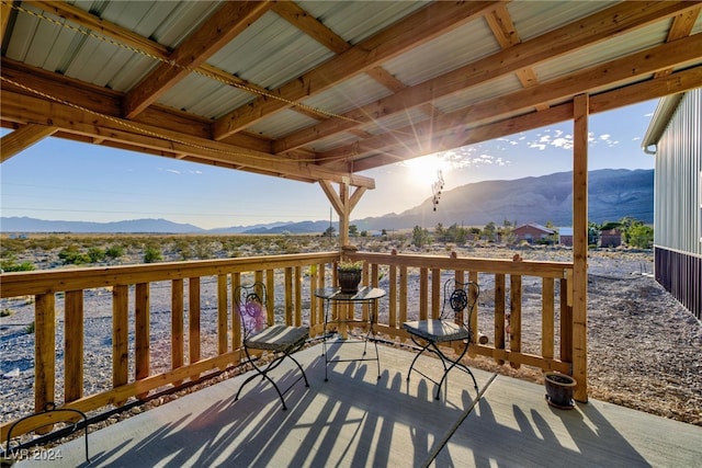 wooden deck featuring a mountain view