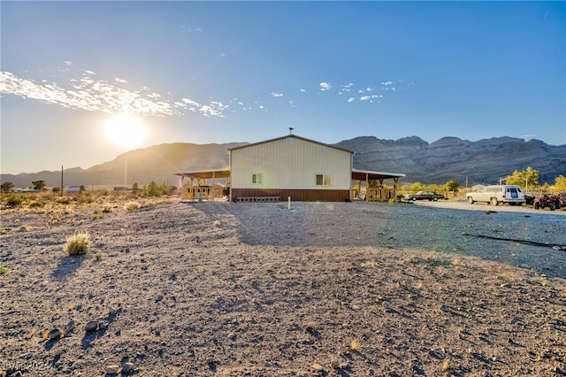 back of house with a mountain view