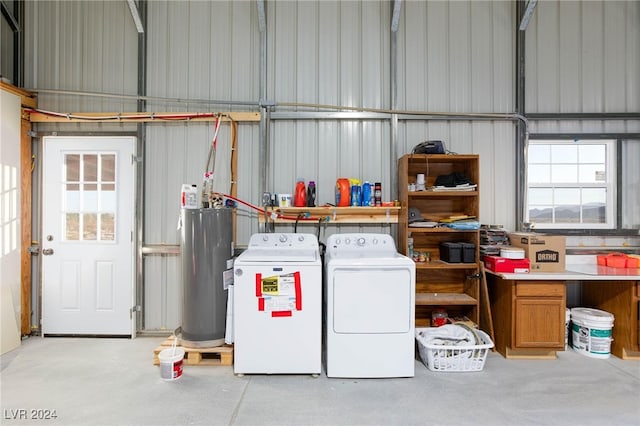 laundry room featuring water heater and separate washer and dryer