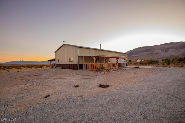 view of front of home featuring a mountain view