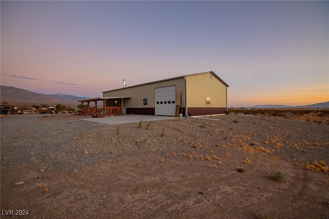 exterior space with a mountain view and a garage