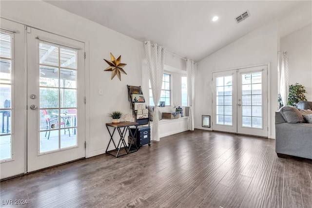 doorway with french doors, dark hardwood / wood-style flooring, and lofted ceiling