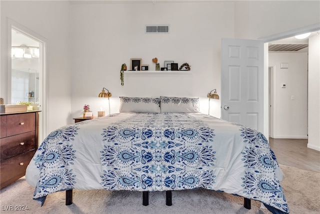 bedroom with wood-type flooring