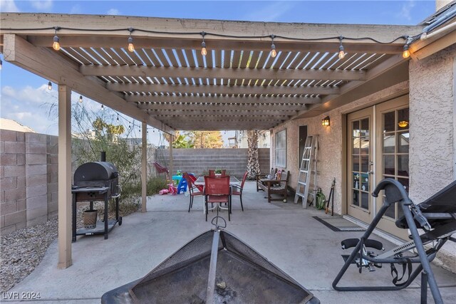 view of patio with a pergola and a grill