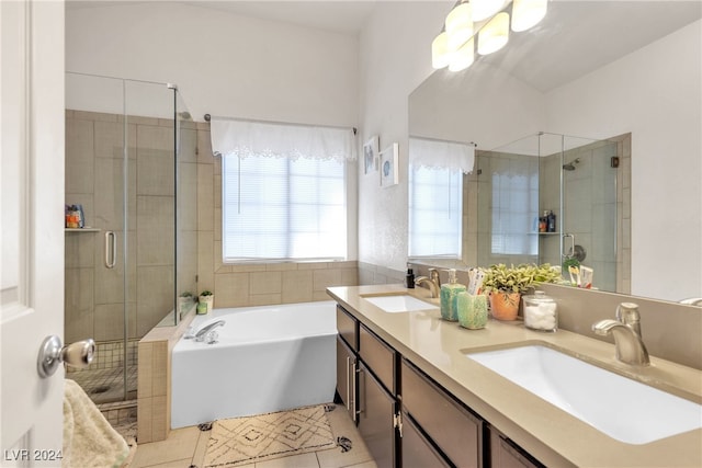 bathroom featuring tile patterned flooring, vanity, and separate shower and tub