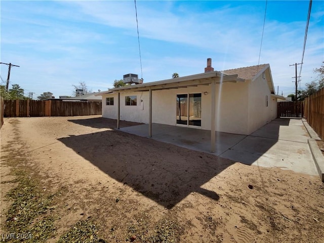 back of property with a patio area