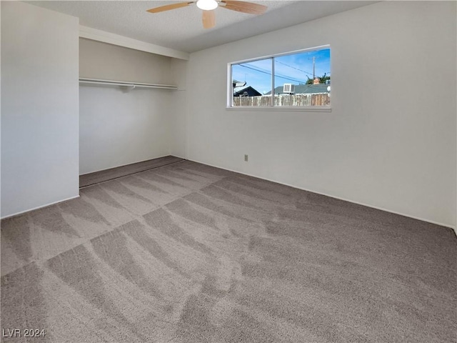 unfurnished bedroom featuring a closet, ceiling fan, and light colored carpet